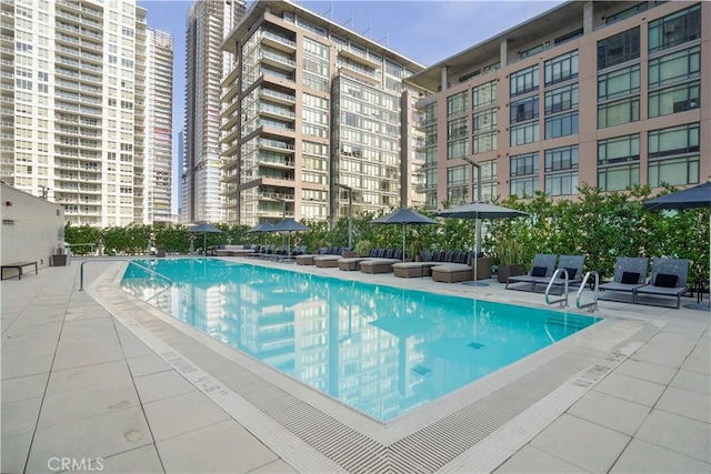 community pool featuring a patio area