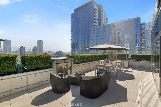 view of patio / terrace featuring a city view