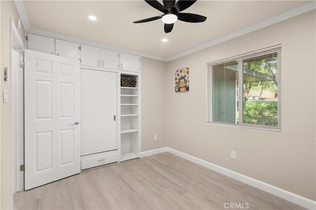 unfurnished bedroom featuring ornamental molding, light wood-style flooring, recessed lighting, and baseboards