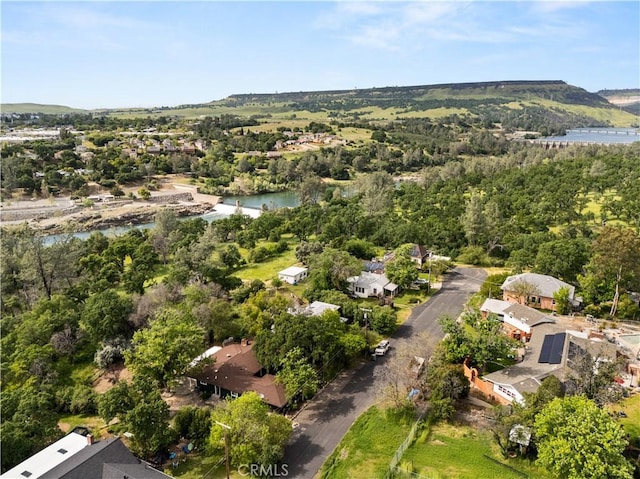 drone / aerial view featuring a residential view and a water view