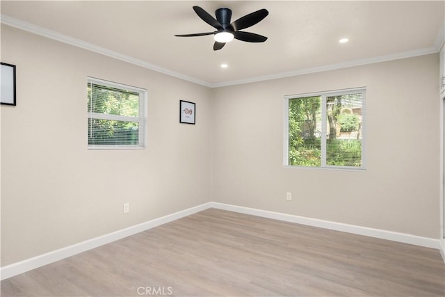 spare room with baseboards, recessed lighting, light wood-style flooring, crown molding, and ceiling fan