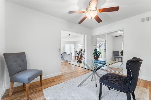 28133 Espinoza, Mission Viejo, CA 92692 - dining room featuring visible vents, light wood finished floors, baseboards, and ceiling fan with notable chandelier