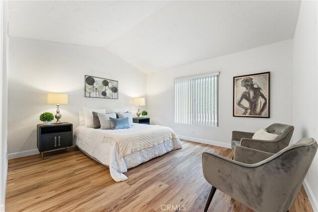 28133 Espinoza, Mission Viejo, CA 92692 - bedroom featuring light wood-style floors, baseboards, and lofted ceiling
