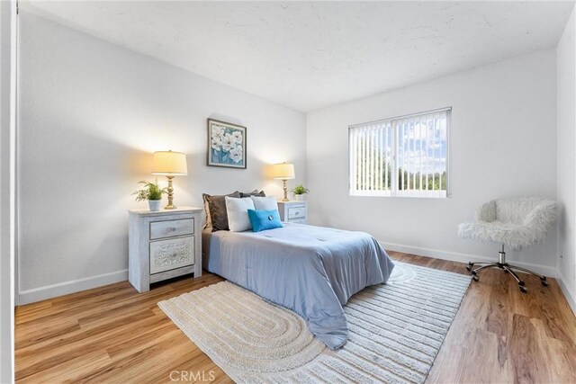 28133 Espinoza, Mission Viejo, CA 92692 - bedroom featuring baseboards and light wood-style floors