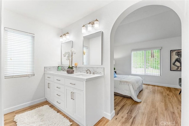 28133 Espinoza, Mission Viejo, CA 92692 - full bath featuring baseboards, wood finished floors, connected bathroom, and a healthy amount of sunlight