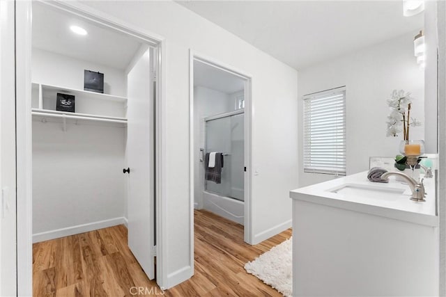 28133 Espinoza, Mission Viejo, CA 92692 - full bath featuring baseboards, vanity, wood finished floors, and shower / bath combination with glass door