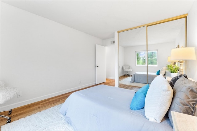 28133 Espinoza, Mission Viejo, CA 92692 - bedroom with wood finished floors, a closet, baseboards, and visible vents