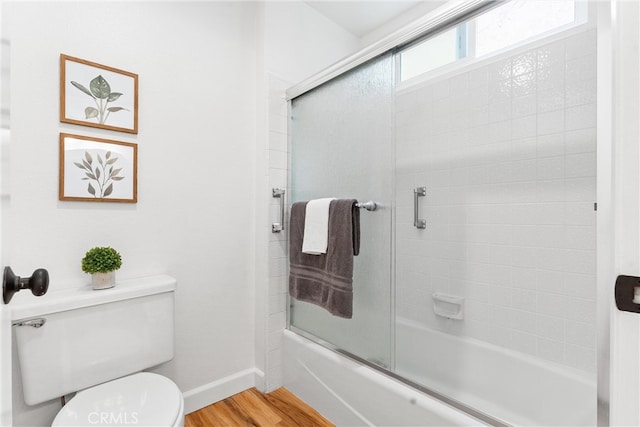 28133 Espinoza, Mission Viejo, CA 92692 - bathroom with baseboards, wood finished floors, combined bath / shower with glass door, and toilet