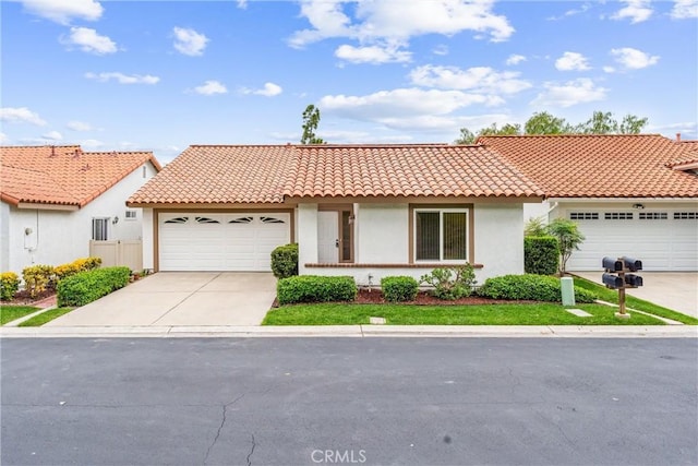 28133 Espinoza, Mission Viejo, CA 92692 - view of front of house with a garage, driveway, a tiled roof, and stucco siding