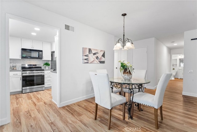 28133 Espinoza, Mission Viejo, CA 92692 - dining room featuring light wood-style floors, visible vents, baseboards, and an inviting chandelier