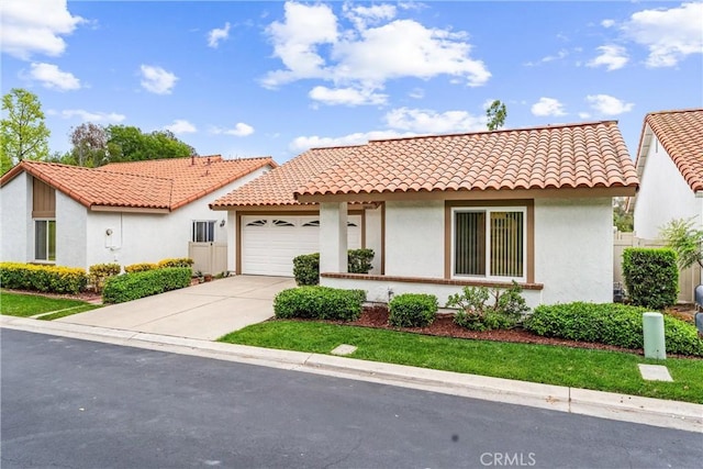 28133 Espinoza, Mission Viejo, CA 92692 - mediterranean / spanish home featuring driveway, stucco siding, an attached garage, and a tile roof
