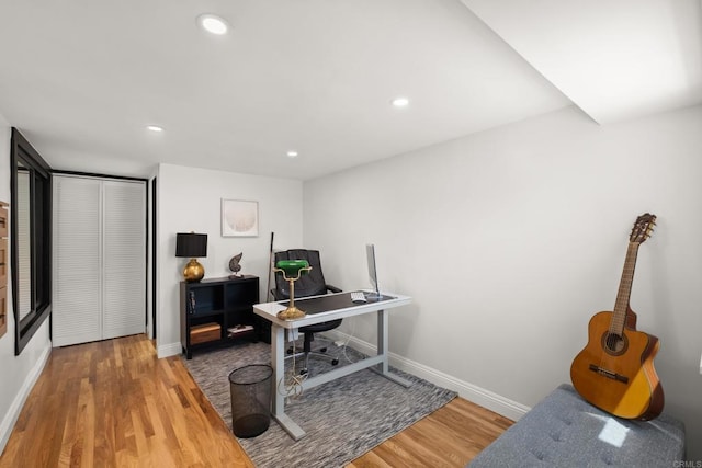 office area featuring baseboards, wood finished floors, and recessed lighting