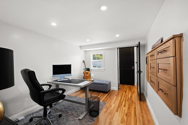 office space with light wood finished floors, baseboards, and recessed lighting