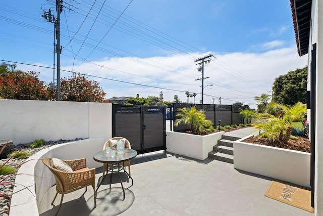 view of patio featuring fence