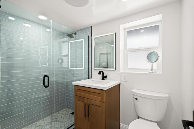 full bath with toilet, a stall shower, vanity, and recessed lighting