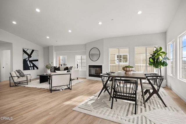 2391 Yorkshire Dr, Los Angeles, CA 90065 - dining room featuring light wood-style flooring, a glass covered fireplace, and recessed lighting