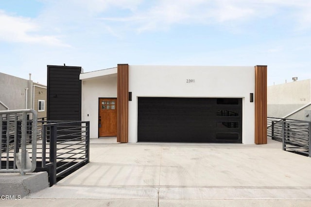 2391 Yorkshire Dr, Los Angeles, CA 90065 - view of front of home with driveway, a garage, and stucco siding