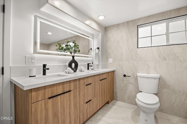 2391 Yorkshire Dr, Los Angeles, CA 90065 - bathroom featuring a sink, tile walls, toilet, and double vanity