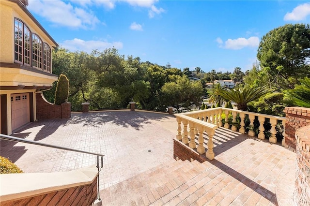 view of patio / terrace with an attached garage