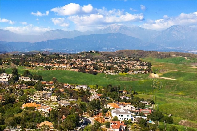 drone / aerial view featuring a mountain view and a residential view