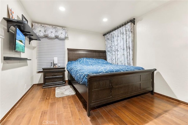 bedroom featuring baseboards, recessed lighting, and hardwood / wood-style floors