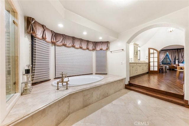 full bathroom featuring recessed lighting, tile patterned flooring, a bath, and vanity