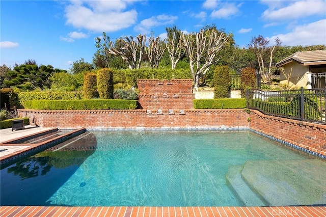 view of swimming pool with a fenced backyard and a fenced in pool