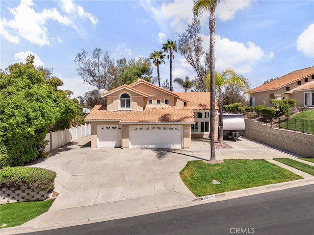30418 Colina Verde St, Temecula, CA 92592 - mediterranean / spanish house with concrete driveway, stucco siding, an attached garage, a tile roof, and fence