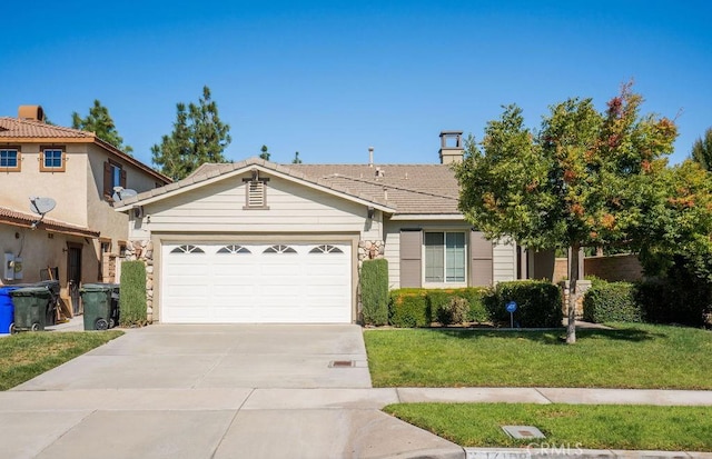 single story home featuring a front yard, an attached garage, driveway, and a chimney
