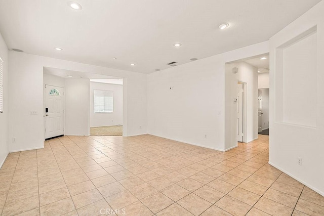 unfurnished room featuring visible vents, baseboards, recessed lighting, and light tile patterned flooring