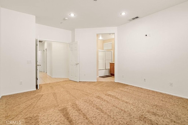 unfurnished bedroom with light colored carpet, baseboards, visible vents, and recessed lighting