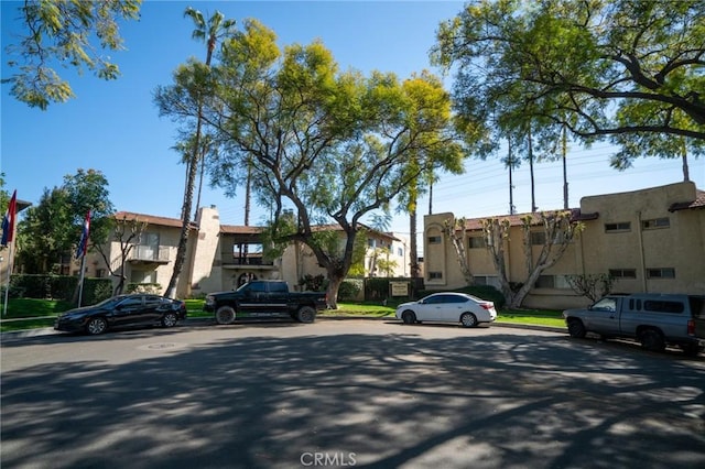view of street with curbs and a residential view