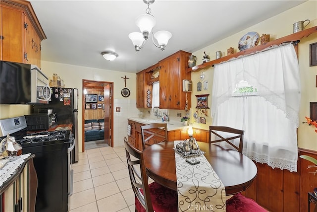 5411 La Madera Ave, El Monte, CA 91732 - kitchen featuring light countertops, appliances with stainless steel finishes, light tile patterned flooring, and a sink