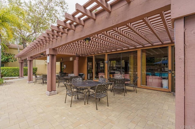 view of patio / terrace with a pergola and outdoor dining area