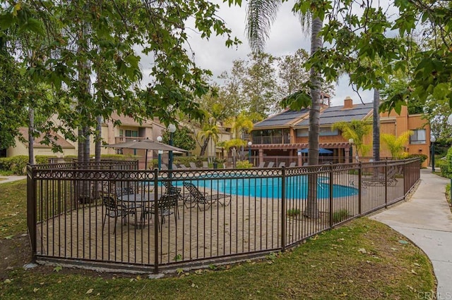 community pool featuring fence
