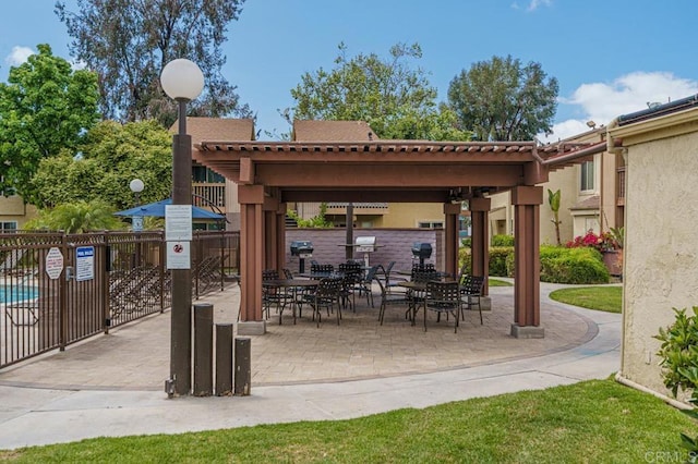 view of patio featuring fence