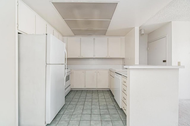 kitchen featuring light countertops, white cabinets, a peninsula, white appliances, and light tile patterned flooring