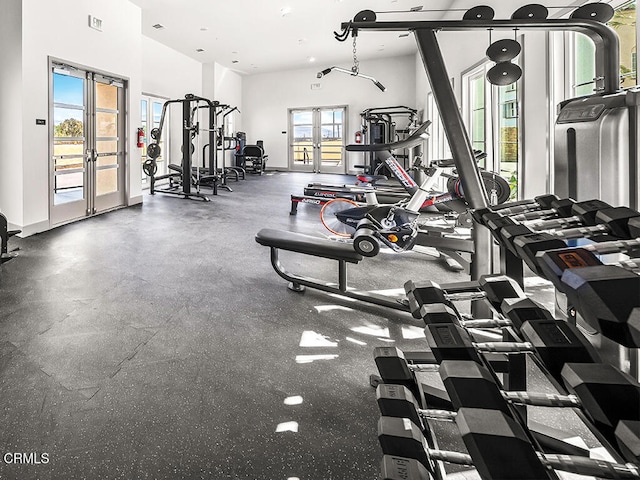 gym featuring french doors, baseboards, and visible vents