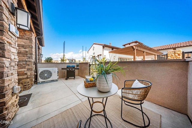 view of patio / terrace with ac unit, a balcony, and a pergola