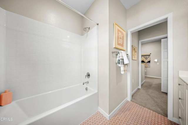 full bath with shower / bath combination, vanity, and baseboards