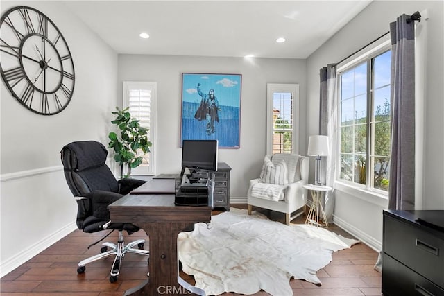 office with a wealth of natural light, recessed lighting, hardwood / wood-style flooring, and baseboards