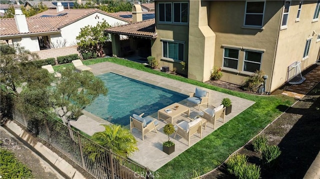 view of swimming pool with a patio and a fenced backyard