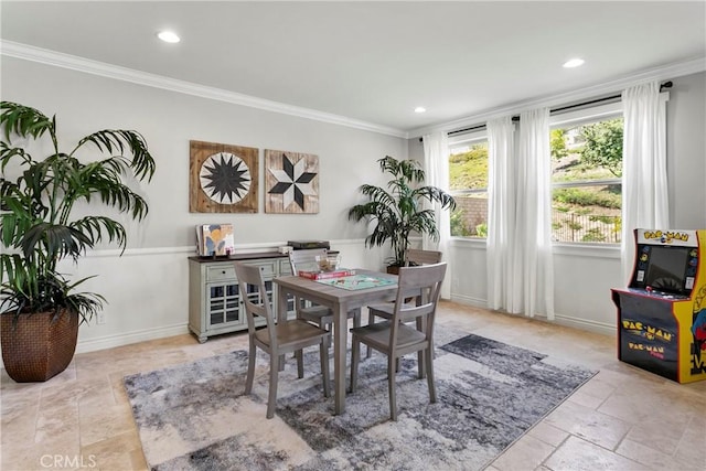 dining space with recessed lighting, stone tile floors, crown molding, and baseboards