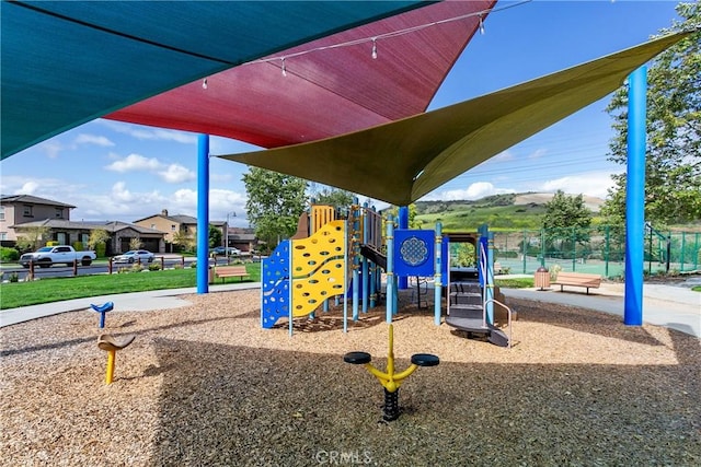 community play area featuring fence