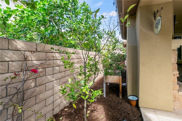 view of home's exterior featuring fence