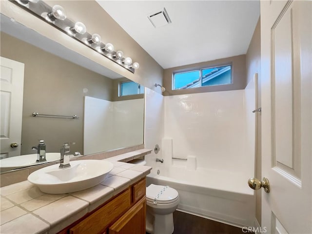 full bath with shower / washtub combination, visible vents, toilet, and vanity