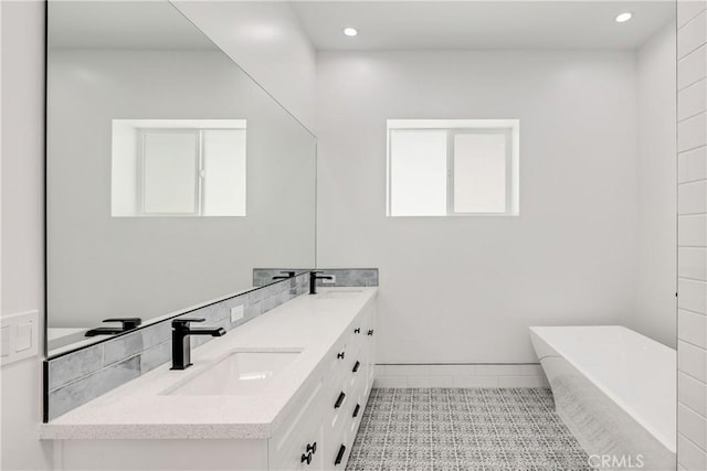 2100 Carnegie Ln, Redondo Beach, CA 90278 - full bath featuring double vanity, a soaking tub, tile patterned floors, and recessed lighting