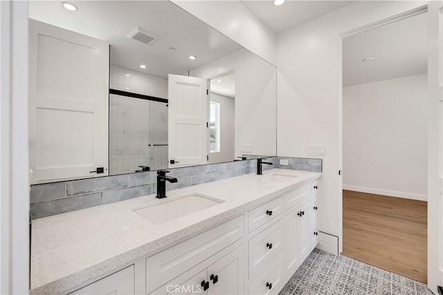 2100 Carnegie Ln, Redondo Beach, CA 90278 - bathroom with double vanity, recessed lighting, a shower stall, and decorative backsplash