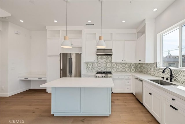 2100 Carnegie Ln, Redondo Beach, CA 90278 - kitchen featuring stainless steel appliances, a kitchen island, range hood, backsplash, and recessed lighting