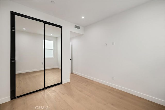 2100 Carnegie Ln, Redondo Beach, CA 90278 - unfurnished bedroom with light wood-style floors, recessed lighting, and a closet